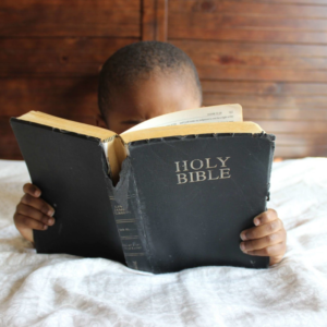 Child reading Bible Teaching Sunday School Curriculum