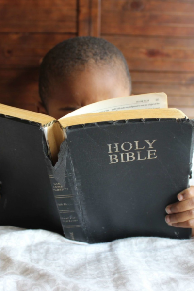 Child reading Bible Teaching Sunday School Curriculum