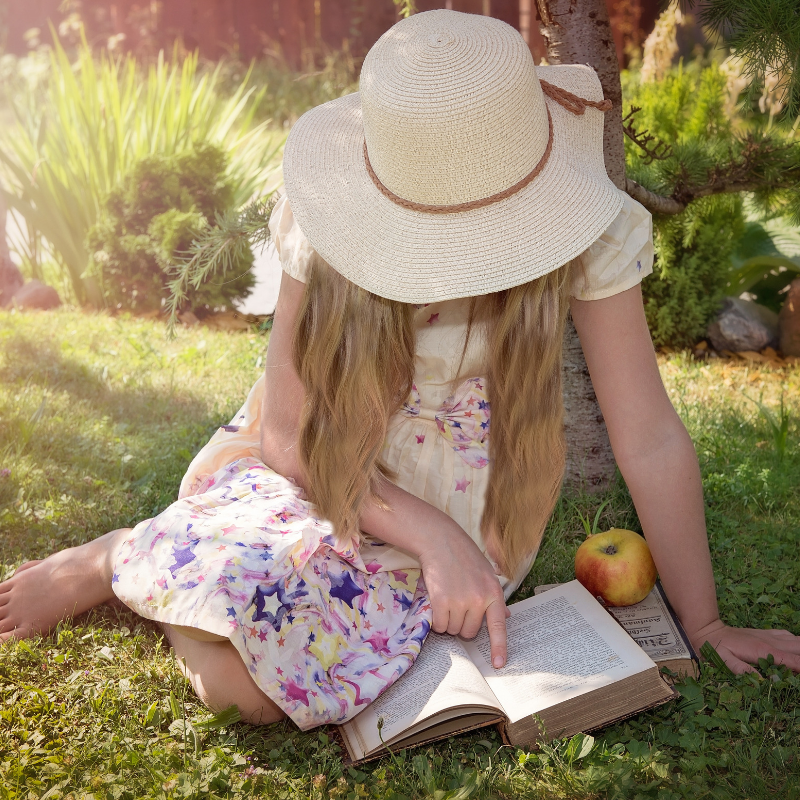 Girl Reading Outside Living Books Charlotte Mason